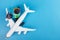 Cheap flight booking, airplane tickets, international flights, travel and trips, plane and globe on a blue background with copy