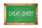 CHEAT  SHEET text written on green school board