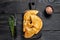 Cheburek meat pastry pie with herbs. Black wooden background. Top view