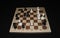 Chechered board with white chessmen as a skill backdrop