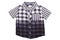 Checked shirts. Close-up of a gray white tartan or plaid shirt for boy isolated on a white background. Childrens summer fashion