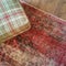 Checked textile hassock and vintage style carpet