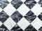 Checkered black and white marble floor tiles background