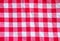 Checkered cloth texture. Red and white squares on textile