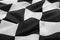 Checkered finish flag as background, closeup view