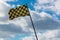 Checkered Flag with Stormy Sky