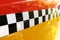 Checkered Yellow Taxi Cab. Abstract background image.
