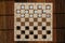Checkers in checkerboard ready for playing. Game concept. Board game. Hobby. checkers on the playing field for a game.