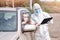 Checking and disinfecting car for virus COVID-19 and bubonic plague border of city and country. Doctor in biohazard suit