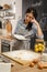 Checking recipe in cookbook. Woman preparing american pie