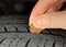 Checking tire tread depth/wear with a penny.  Tire safety and maintenance