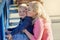 These cheeks were made for moms kisses. Portrait of a mother posing with her little boy on her lap while enjoying a day