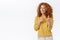 Cheeky, friendly good-looking redhead curly woman in yellow sweater, pointing finger pistols at camera and smiling