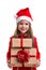 Cheered christmas girl holding two gift boxes in the hands, wearing a santa hat isolated over a white background