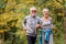 Cheerful active senior couple jogging in the park