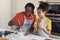 Cheerful African American Dad And Daughter Cooking Together In Kitchen