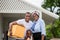 Cheerful african american family with luggage and carrying boxes into new home, Happiness family on moving day concepts