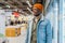 Cheerful African-American guy in denim jacket in supermarket