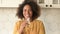 Cheerful African-American woman drinking fresh water