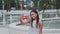 Cheerful african girl taking selfie in front of fountains