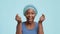 Cheerful African Lady Showing Heart Symbol Crossing Fingers, Blue Background