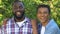 Cheerful afro-american teenager hugging smiling father, happy family portrait