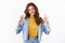 Cheerful ambitious and self-assured redhead woman in denim jacket approve good idea, show satisfactory okay, ok sign and