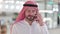 Cheerful Arab Businessman Talking on Smartphone