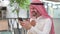 Cheerful Arab Businessman Talking on Smartphone