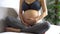 Cheerful Asian pregnant woman in sportswear touching baby inside stomach