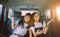 Cheerful asian teenager happiness emotion sitting in passenger car