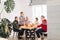 Cheerful attractive woman offers tasty meal to her relatives