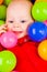 Cheerful baby with balls