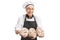 Cheerful baker with freshly baked loaves of bread