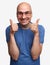 Cheerful bald man shows his thumbs up