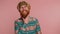 Cheerful bearded hippie hipster redhead man fashion model in pattern shirt smiling looking at camera