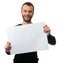 Cheerful bearded man shows a blank paper sheet
