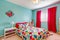 Cheerful bedroom interior in turquoise color