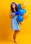 cheerful birthday woman with gift balloons on background. photo of birthday woman