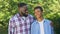 Cheerful black dad and son smiling on camera, trustful relations, friendship