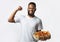 Cheerful Black Man Holding Pizza Box Standing Over White Background