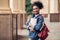 Cheerful Black Student Girl Hugging Books Posing Near College Building