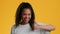 Cheerful Black Teenager Girl Gesturing Thumbs Up Over Yellow Background