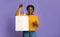 Cheerful Black Woman Holding And Pointing At Blank Textile Tote Shopping Bag