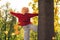 Cheerful blond Caucasian hipster enjoys her time in the park medium full shot copy space outdoors