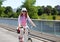 Cheerful blond woman riding a bicycle