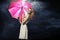 Cheerful blonde lady with the pink umbrella