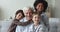 Cheerful boys and senior grandma grandfather looking at camera