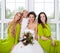 Cheerful bride with female friends and little flower girl