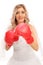 Cheerful bride with red boxing gloves